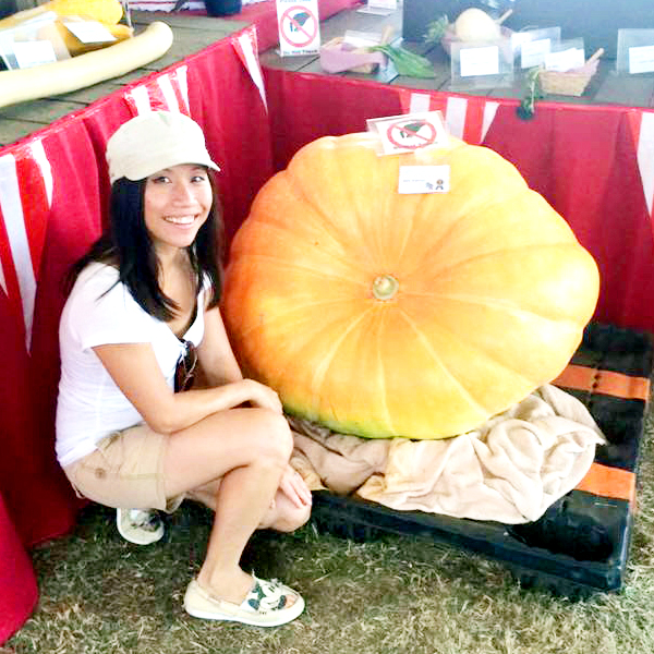 Personal Chef Eliette with a large pumpkin at the Pomona Fair.