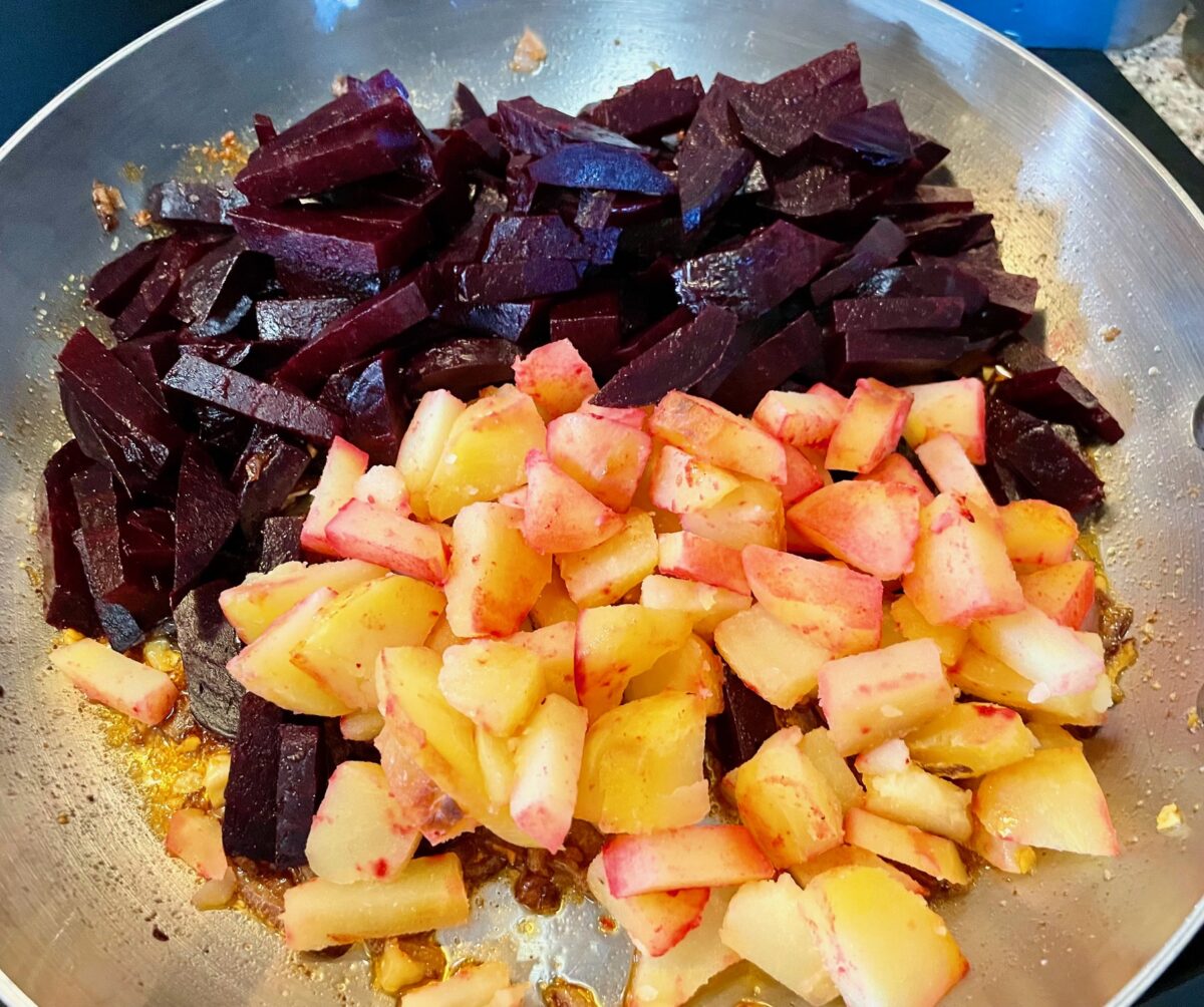 Cut beets and potatoes in a large stainless steel pan.