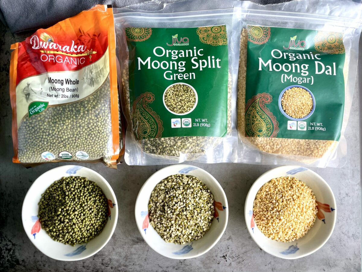 Dwaraka organic mung beans, Jiva organic split moong dal and Jiva organic yellow moong dal, in packaging and displayed in bowls.