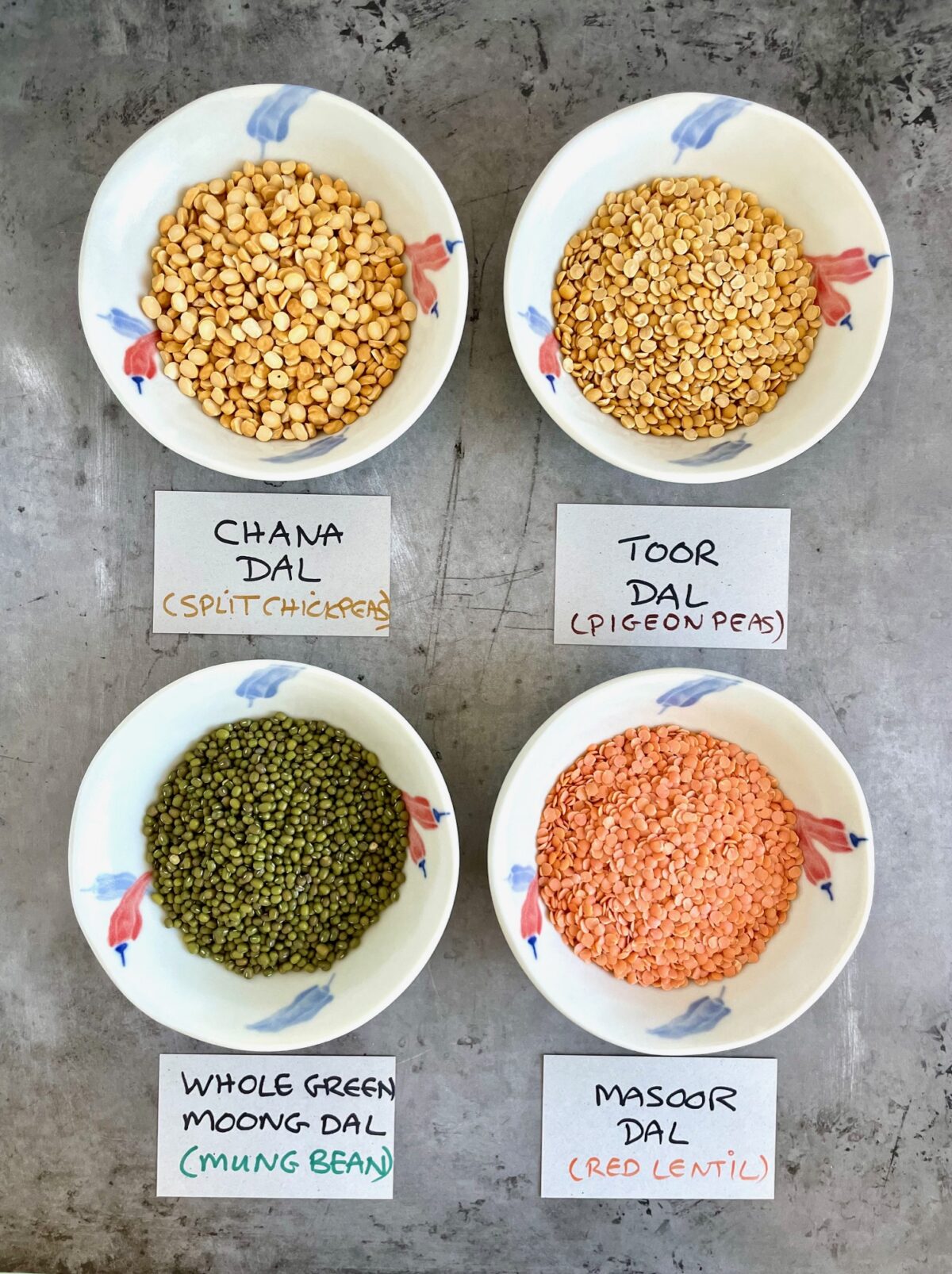 Different types of gluten free dals in packages and in bowls.